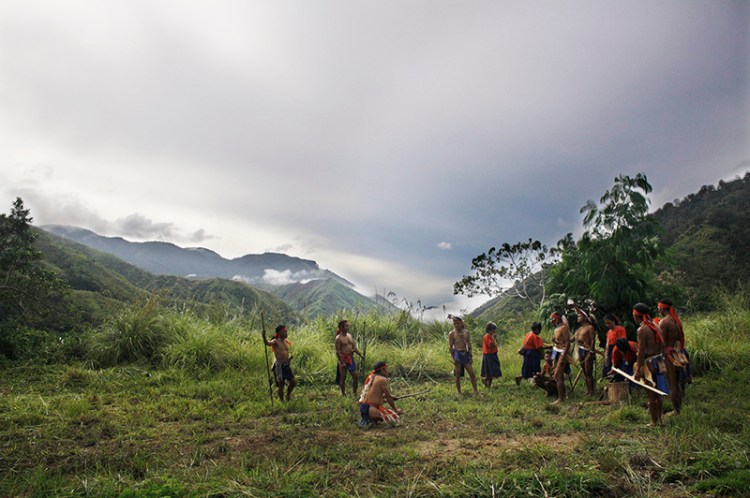 The Bugkalot put on a presentation with their traditional gear to show the group some old hunting rituals from their tribal history